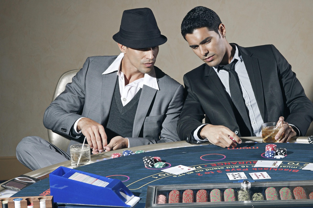 Baccarat casino table with cards spread — the canonical game of nine