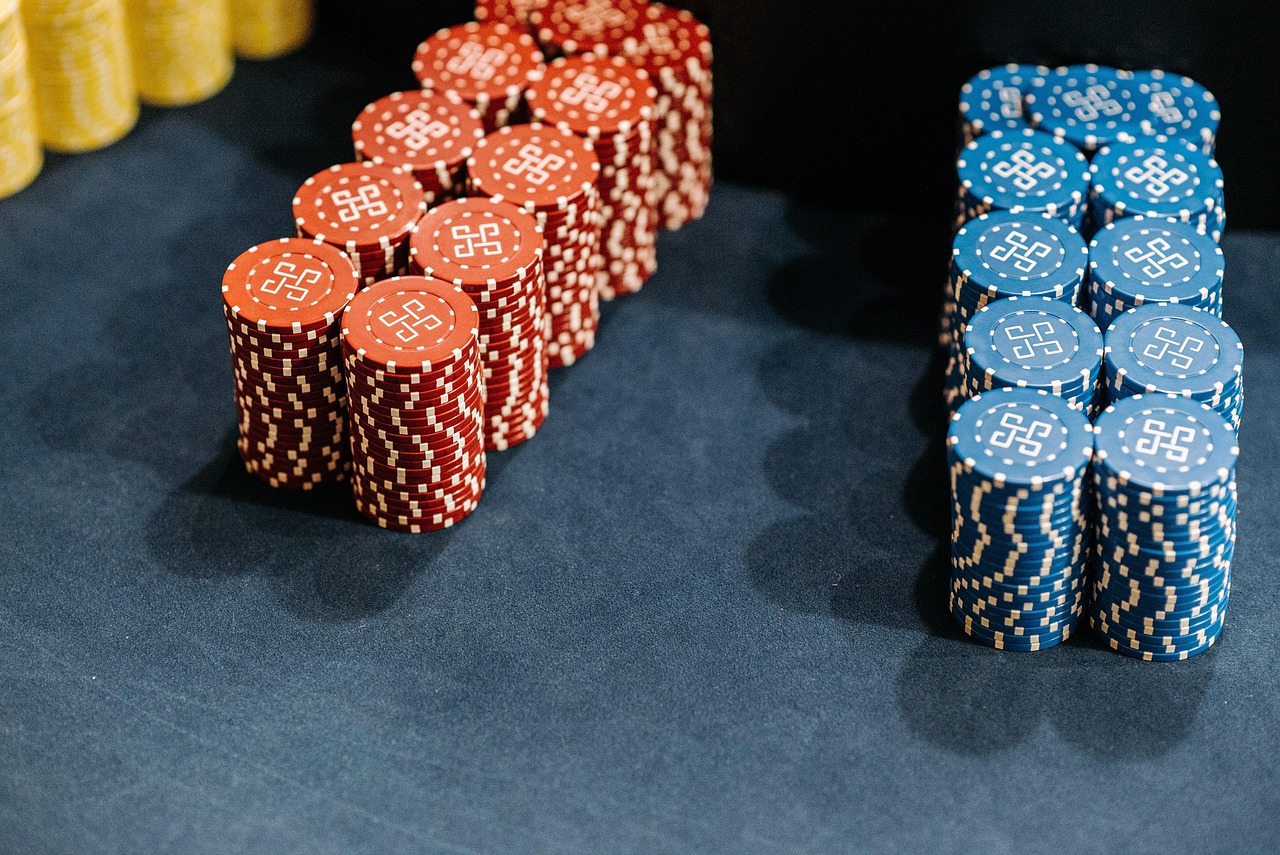Multi-color casino chips by denomination — the standard color-coded currency